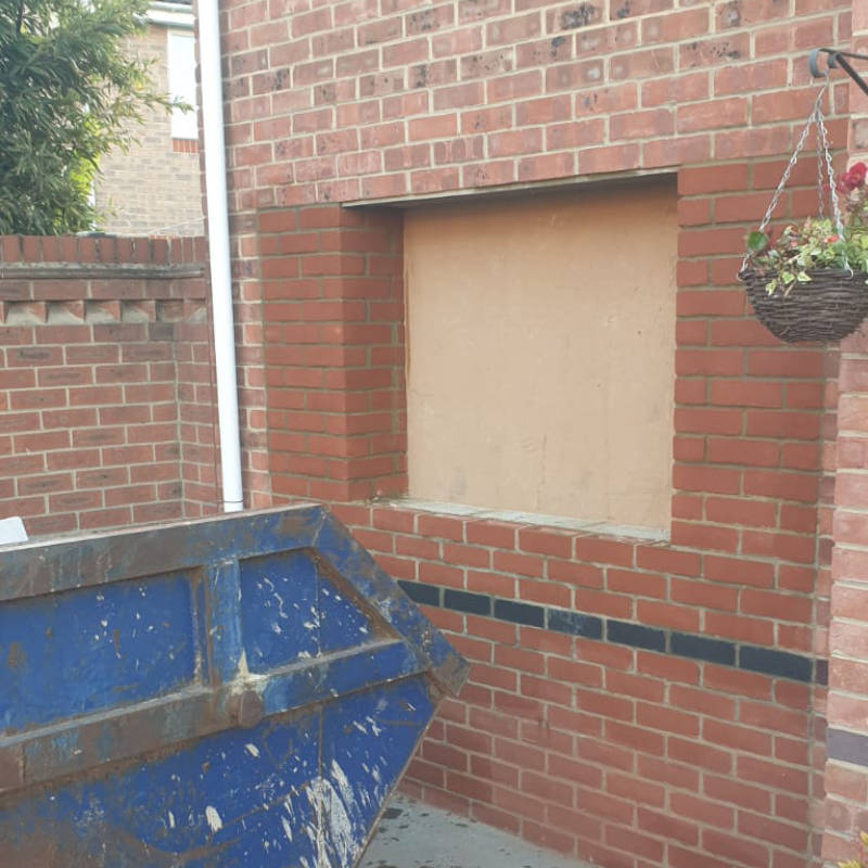 Photo of garage conversion door bricked over maldon